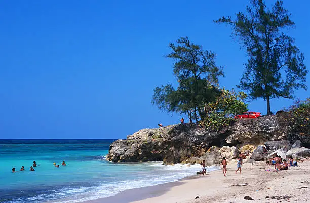 "Beach life in Cuba with oldsmobile. Cuba, beach close to Havana"