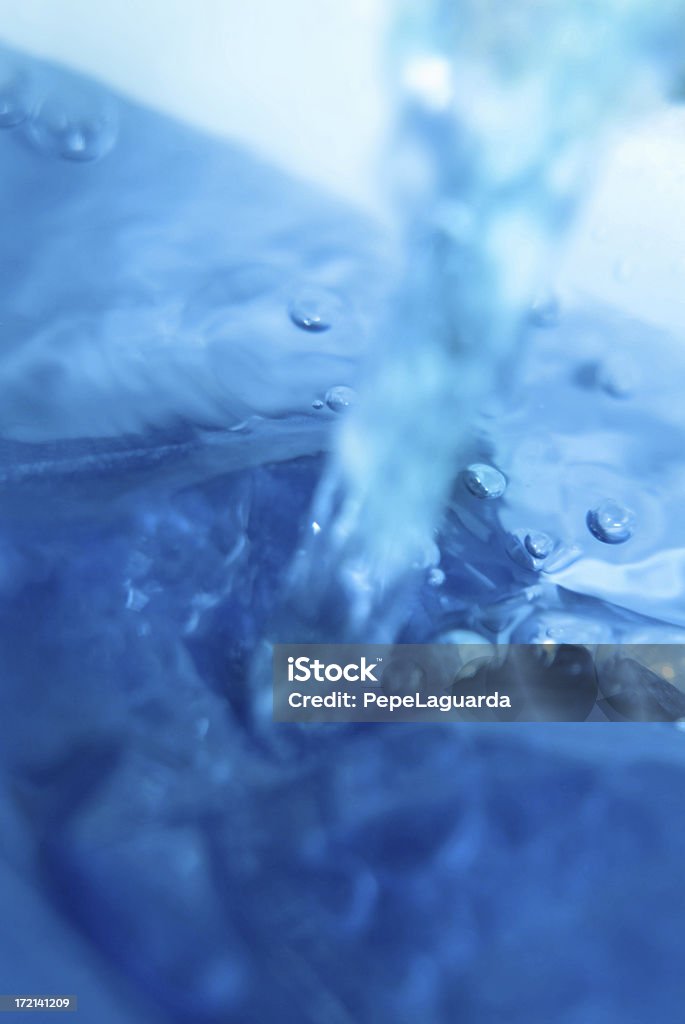 abstract: pouring water close-up of water pouring Abstract Stock Photo