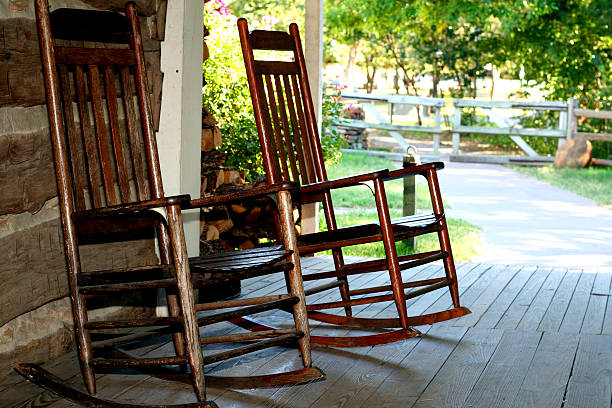 istock Two brass rocking chairs on a patio 172141466