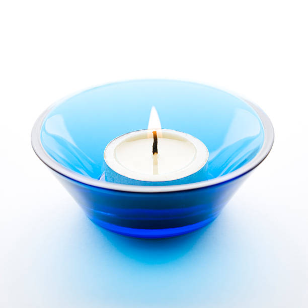 свеча на белом фоне - tea light candle white single object стоковые фото и изображения