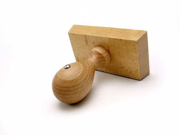 Wooden Stamp On White Background stock photo