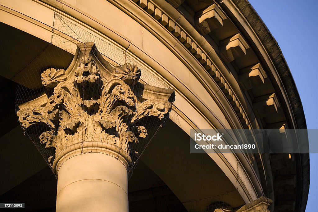 Architectural detail "The stone column on an old Victorian building in the historic town of Saltaire, Yorkshire, England.  There is protective wires around the top of the column." Yorkshire - England Stock Photo