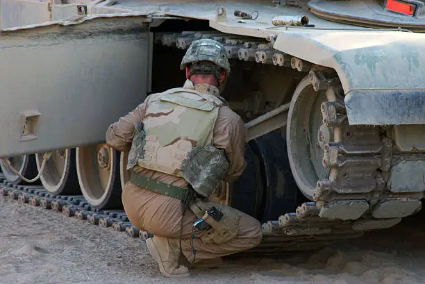 "M1 Abrams Main Battle Tank crew prepares for combat patrol in Ramadi, Iraq."