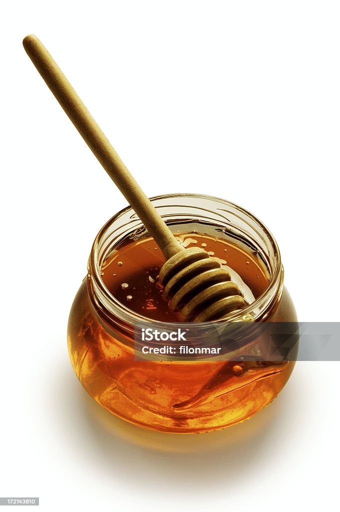Стекло honey с палками - Стоковые фото Мёд роялти-фри