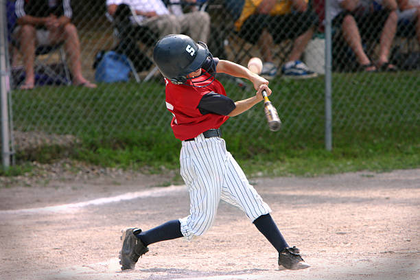 Baseball player hitting foul ball little league batter fouls off a pitch youth baseball and softball league photos stock pictures, royalty-free photos & images