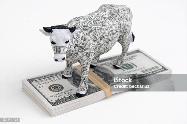 Cash Cow On Pile Of Money Bills Stock Photo - Download Image Now - Cash Cow, Currency, Concepts