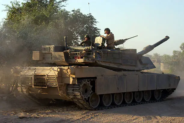 M1 Abrams Main Battle Tank crew prepares for combat patrol in Ramadi, Iraq. 