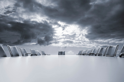 A meeting room with storm clouds above. Blue tint. 