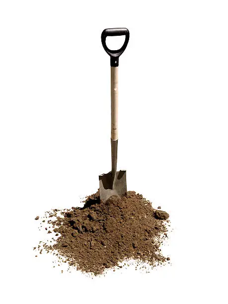 Shovel standing in heap of dirt. On pure white.