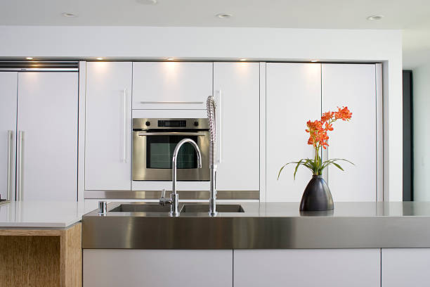 istock Modern white kitchen with stainless steel counter and oven 172146366