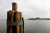 Dockside Wooden Pier Pilings Over Harbor