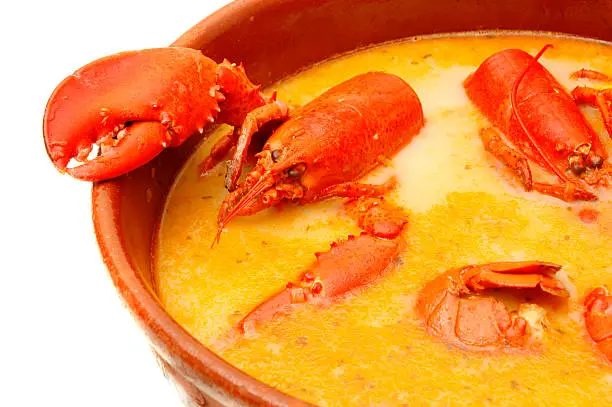 This is the most famous dish of Mallorca and Menorca, a kind of lobster casserole, made with lobster, onions, tomato, garlic  herb-flavored liqueur, seafood broth and bread. Really tasty.
