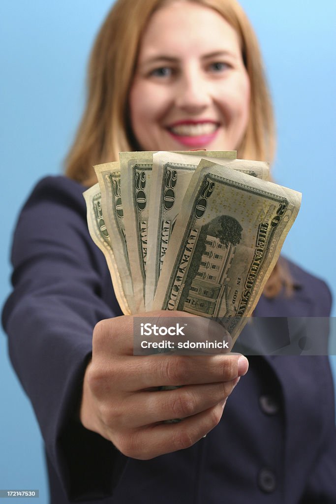 Made Some Money! "A happy business woman holding some 20's.  Shallow DOF, focus is on the money." Adult Stock Photo