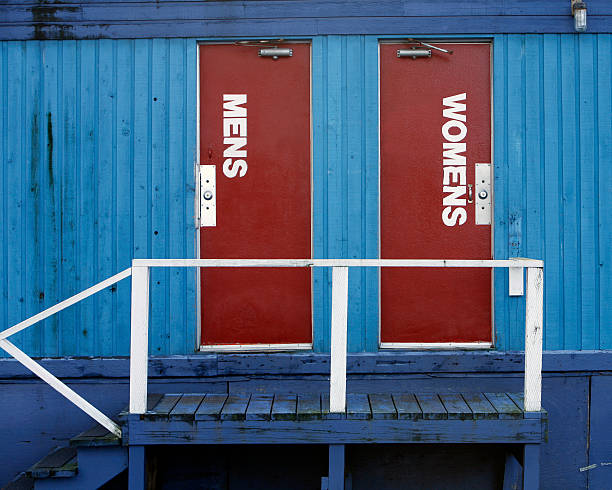 Block of five public toilet cubicles on the seafront promenade at Bognor Regis in West Sussex, England