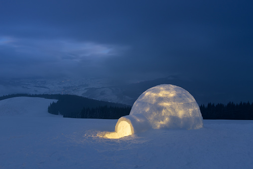 Winter Landscape with a Snowy Igloo at Night