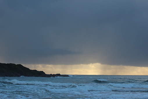 Rain on the horizon over sea