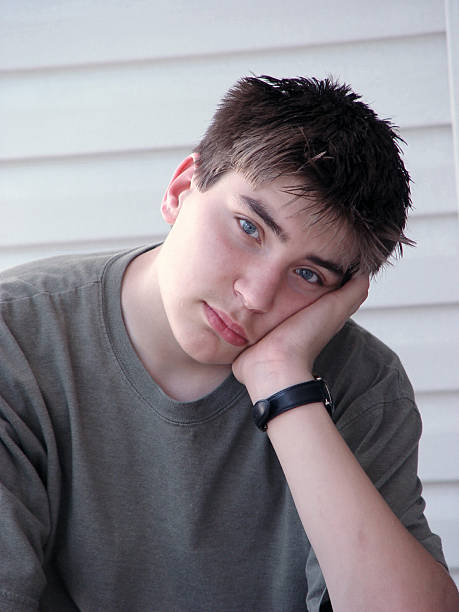 istock teen portrait - young man leaning 172150101