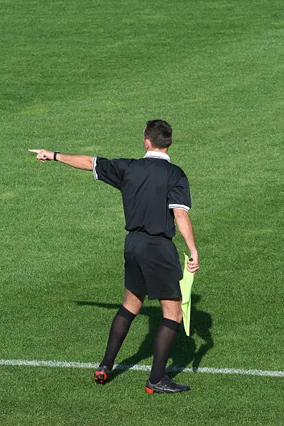 Referee warning players of the match