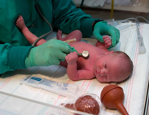 istock Newborn Baby examined in hospital 172151663