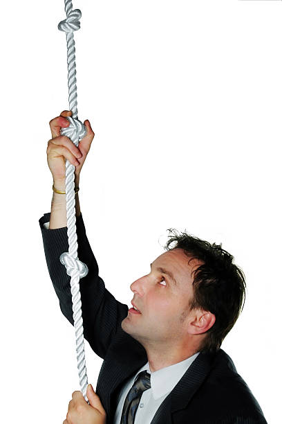 istock Businessman climbing a rope 172152071