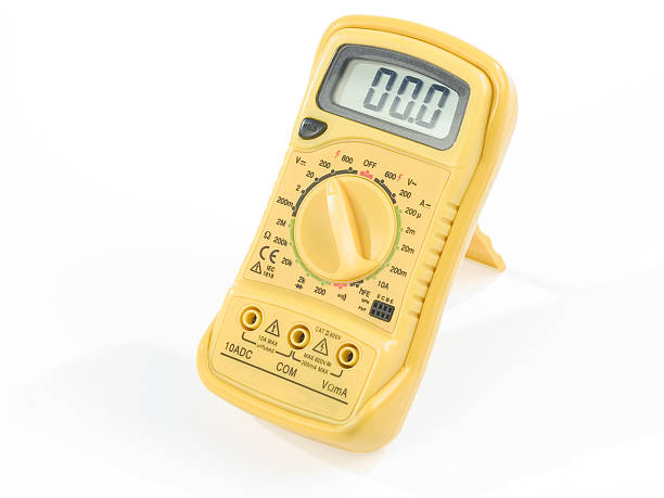 Digital Multimeter "White isolated yellow digital multimeter set up to measure volts, indicating 00.0 on the display" cable tester stock pictures, royalty-free photos & images