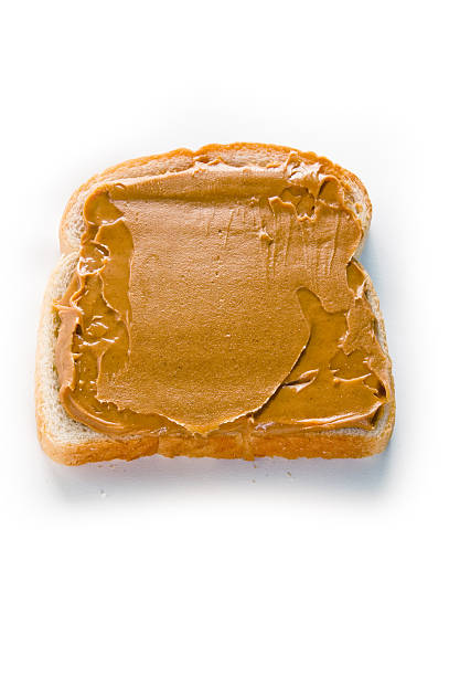 Slice of White Bread with Peanut Butted stock photo