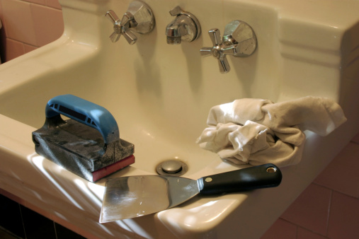 Tools on sink in bathroom for paint preparation and improvement