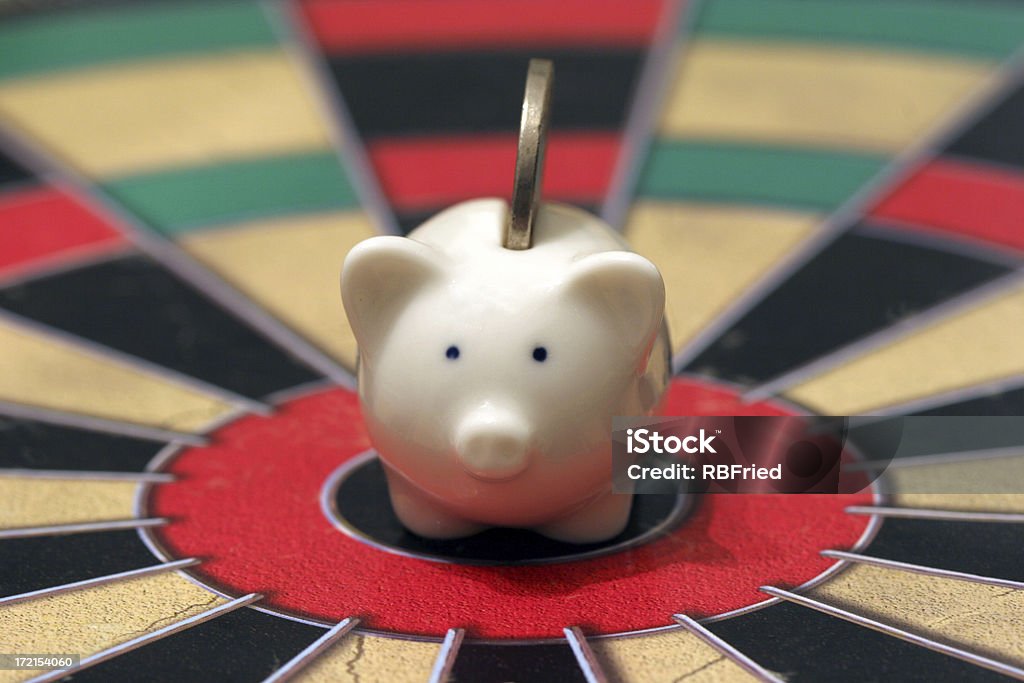 Savings target a piggy bank on a target Mutual Fund Stock Photo