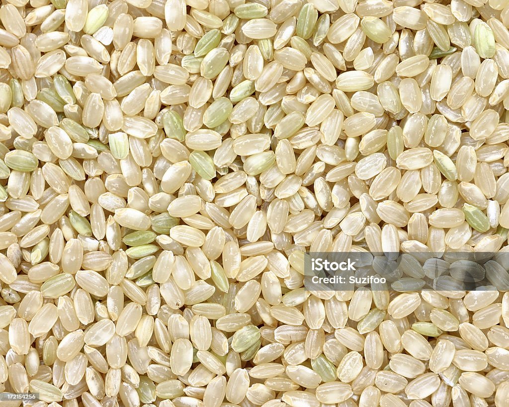brown rice (short grain) "Short grain brown rice (whole grain). When cooked, short grain rice is stickier than long grain rice." Backgrounds Stock Photo