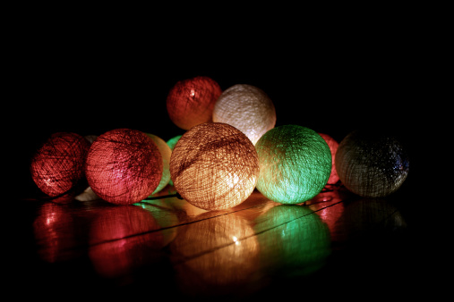 Christmas celebration holiday background. Colorful Christmas balls Christmas baubles and colorful xmas lights background