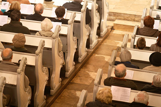 istock Praying in a church 172154702
