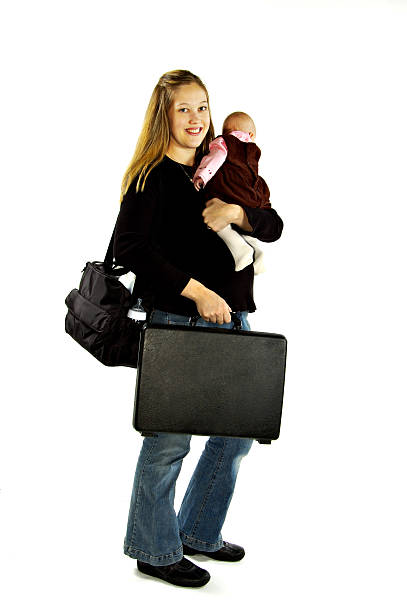 istock Working mom carrying brief case and sleeping baby on white 172154955