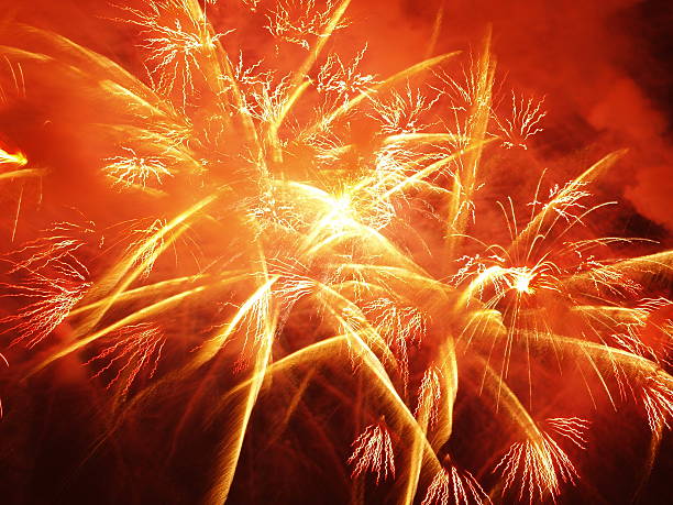 Close-up of orange and golden fireworks sparks stock photo