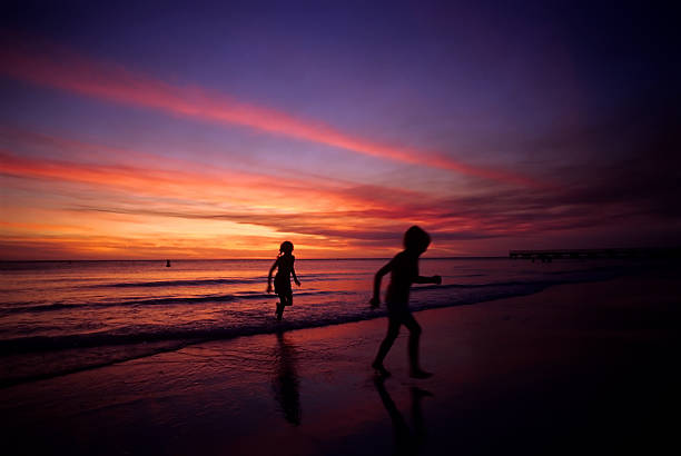 istock happy children running on the beach 172156135