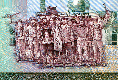 Portion of an old Iranian 2000 Rials banknote. Shows revolutionaries holding Ayatollah Khomeni's picture.