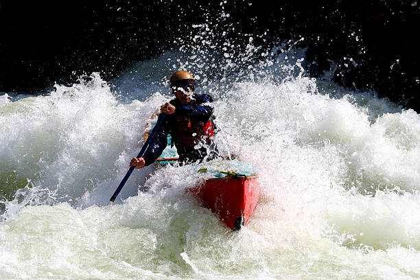 red canoe - wildwasserkanufahren stock-fotos und bilder