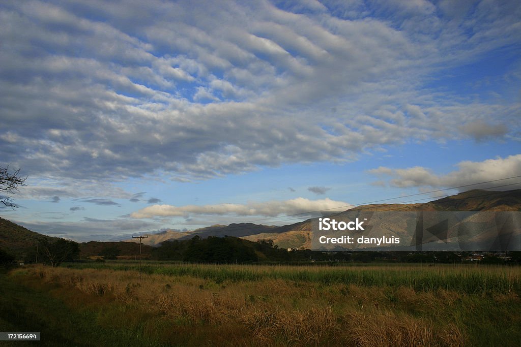 Southamerica country landscape "Southamerican country landscape, with contrasting clouds and sky." Maracay Stock Photo