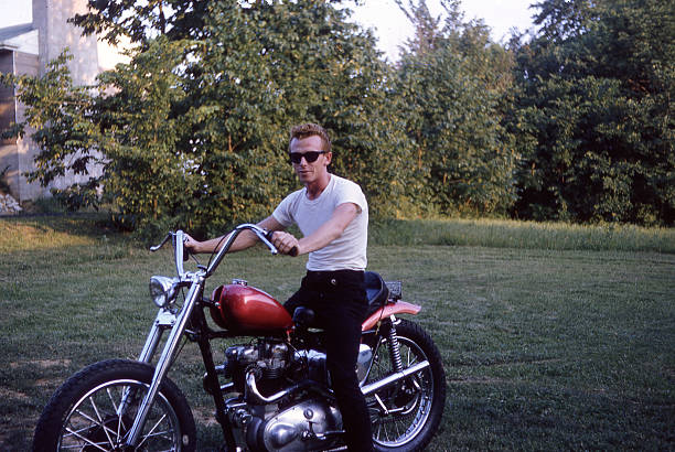 Fifties Motorcycle Guy - Biker My brother-in-law in the summer of 1970 - focus on bikeNOTE: This picture is over 30 yrs. old & contains slight grain biker photos stock pictures, royalty-free photos & images