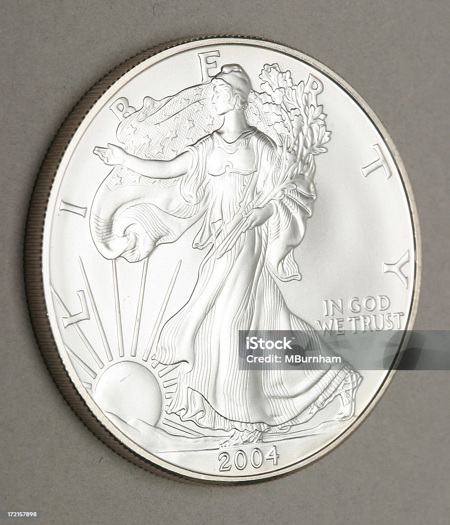 2004 Silver Dollar "A macro shot of a US silver dollar, this is issued by the US mint and is 99.999% pure silver." 2004 Stock Photo