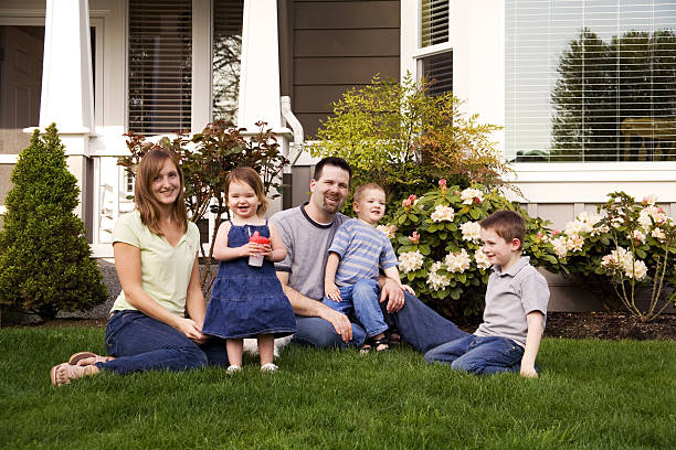 istock young family at home outdoors sitting in grass 172158058