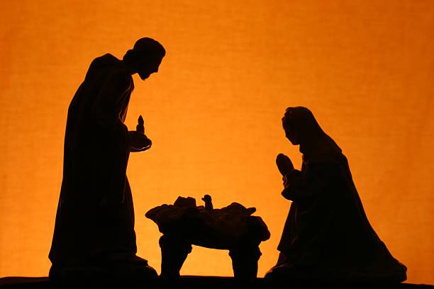 Religious: Christmas Nativity Trio Silhouette on Gold stock photo
