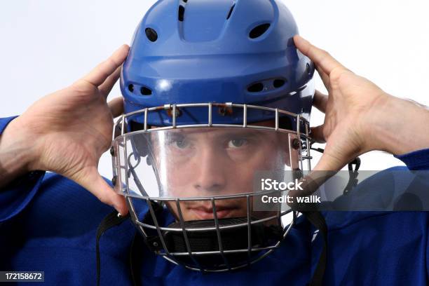 Hockey Player Stock Photo - Download Image Now - Activity, Aggression, Blue