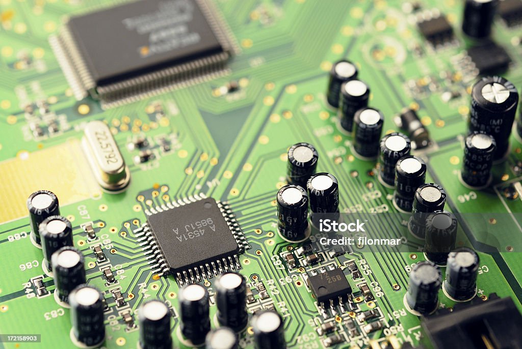 Chips, capacitors and crystal Electronic parts on PCB Computer Wafer Stock Photo