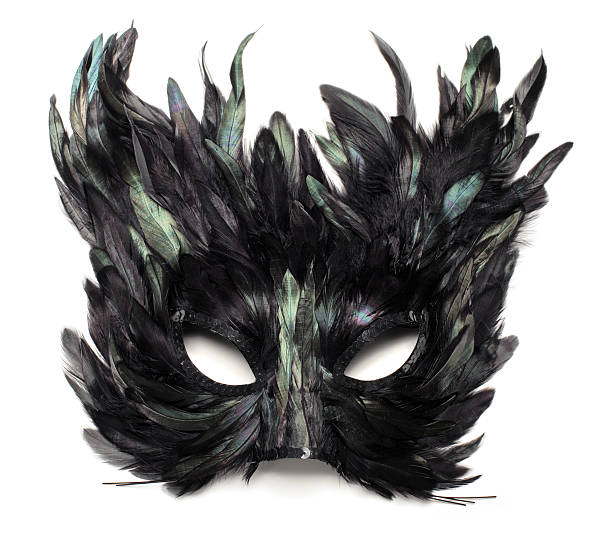 Black and green feather cat mask (isolated) stock photo