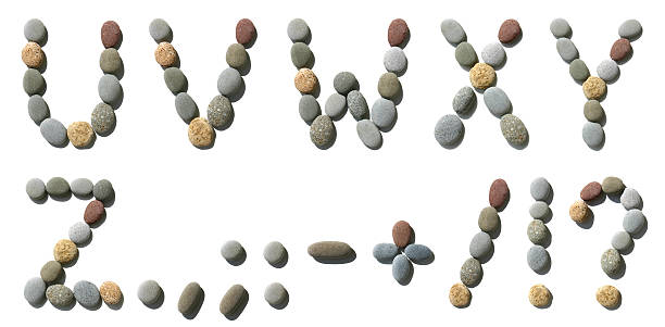 High-res English alphabet made of sea colour stones isolated on a white background. The stones have natural shadows
