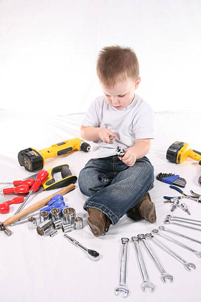 child with tools stock photo