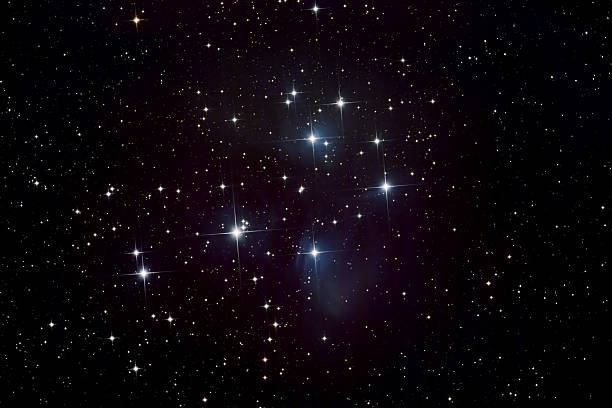 Pleiades Star Cluster and Nebula "Telescope image of the Pleiades (Seven Sisters, Subaru) star cluster taken from my backyard observatory, showing bright stars and nebula." the pleiades stock pictures, royalty-free photos & images