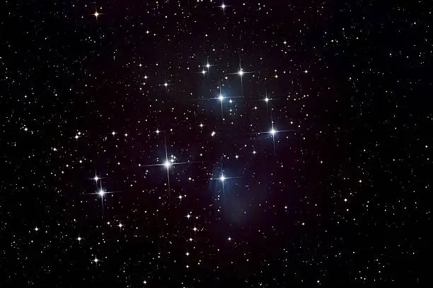 "Telescope image of the Pleiades (Seven Sisters, Subaru) star cluster taken from my backyard observatory, showing bright stars and nebula."