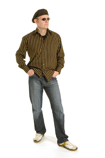 istock Man with hands in pockets standing against white background 172161784