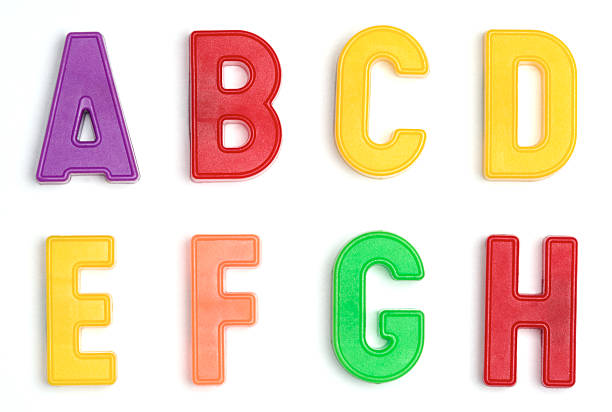 Colored plastic letters A through H Magnetic letters A through H on a white background. Mix and match 'em. Shot in small groups with a telephoto for minimal pespective distortion and maximum size. letter f photos stock pictures, royalty-free photos & images